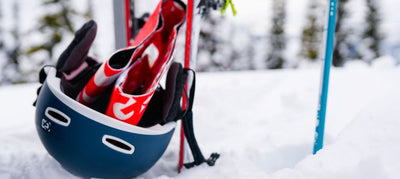 climbing skins in helmet with poles in background